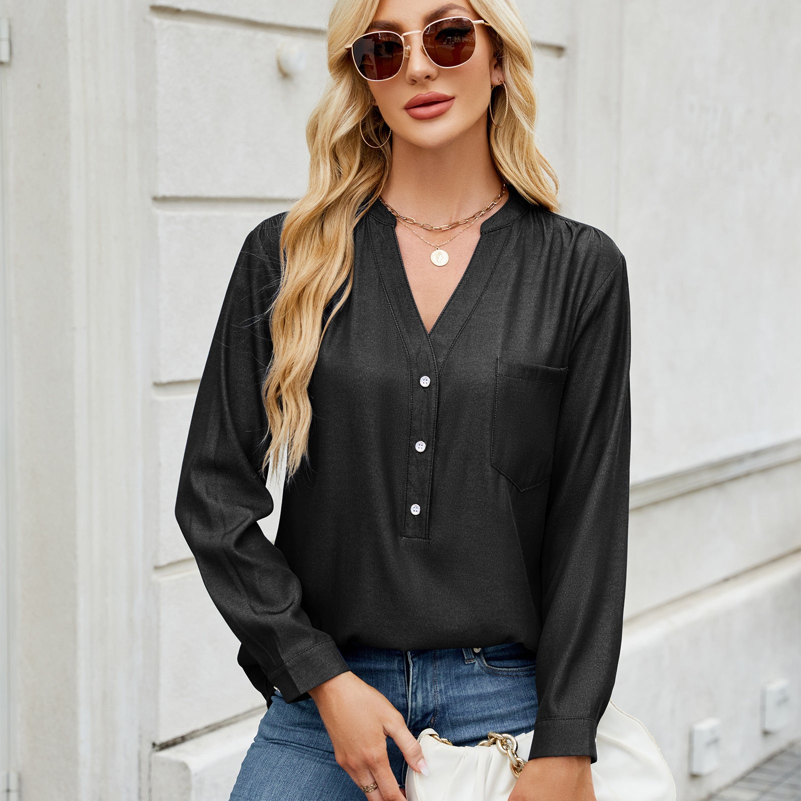 A row of button-down imitation denim, long-sleeved shirt and top